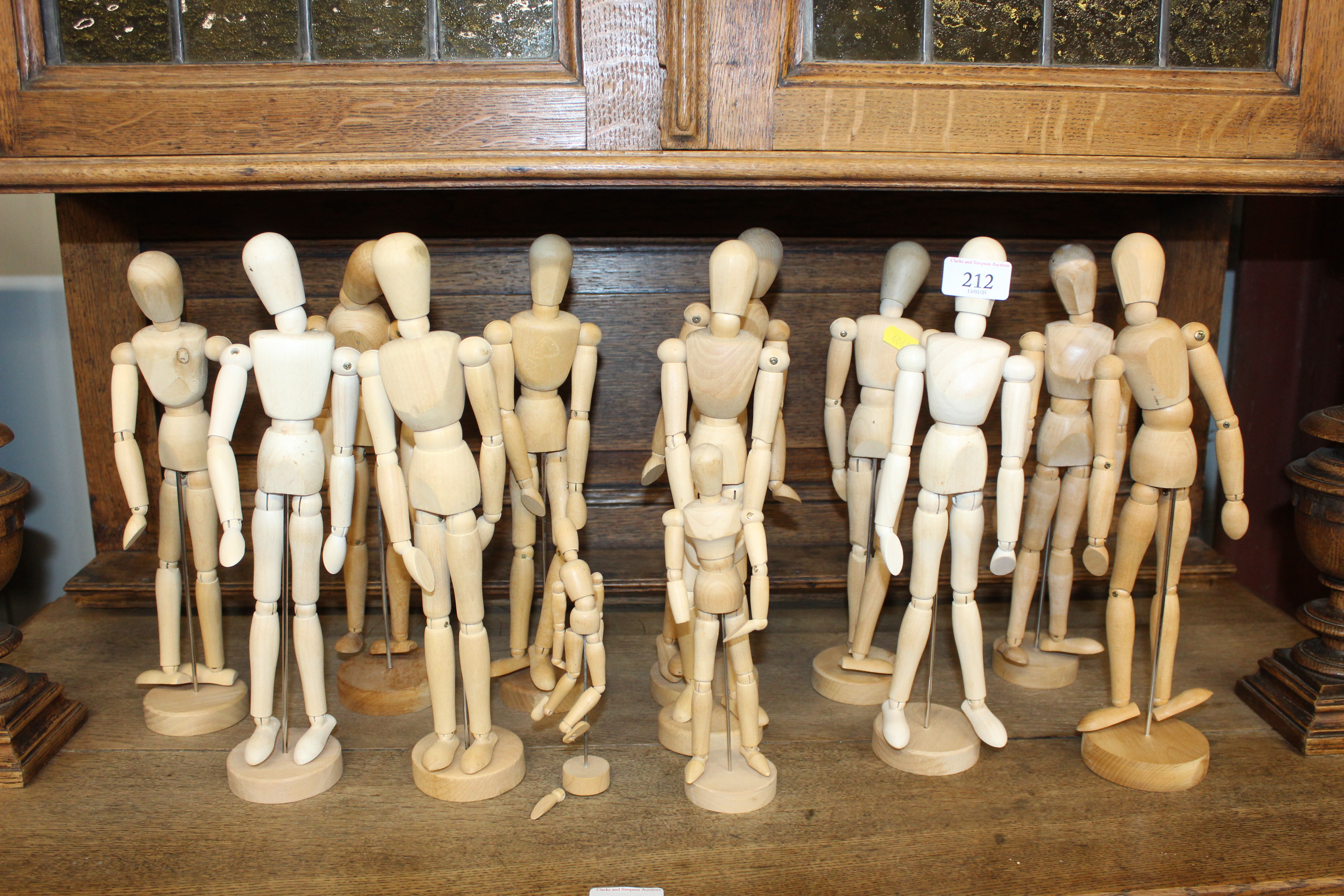 A quantity of artists lay style wooden dolls