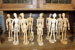 A quantity of artists lay style wooden dolls
