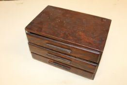 A three drawer chest containing bone mounted Mah J