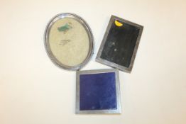 Two silver mounted photo frames and an oval photo