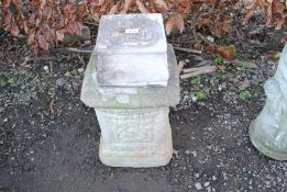 A concrete garden plinth and another garden plinth
