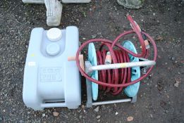 A garden hose reel and length of hose; and a Fiamm