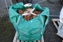A dumpy bag containing a quantity of various sawn