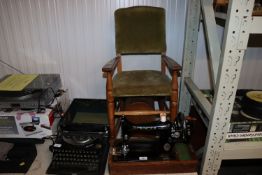 A Singer sewing machine in fitted case, and a chil