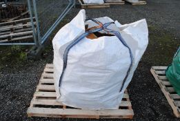 A dumpy bag containing a quantity of various sawn