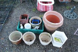 A quantity of various plastic and glazed plant pot