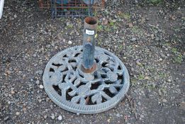 An ornate floral patterned parasol base