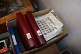 A box containing a large quantity of loose stamps,