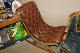 A mahogany framed leatherette button down upholste