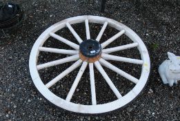 A wooden and metal banded cartwheel, measuring app