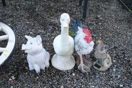 Four various garden ornaments in the form of farmy