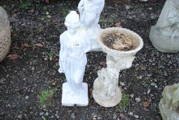 A garden water feature in the form of a maiden hol