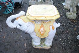 A painted glazed statue of an Indian elephant with