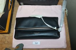 A Radley London clutch and a dust bag