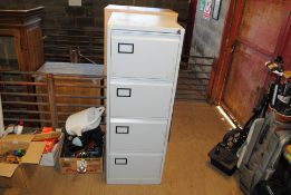 A metal four drawer filing cabinet
