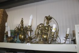 A pair of brass six branch ceiling lights