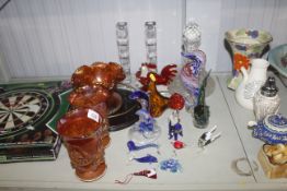 A pair of glass candle sticks, various glass ornam