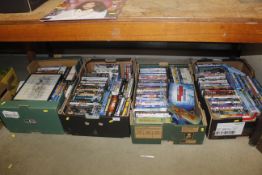 Four boxes containing various DVDs and a John Western print