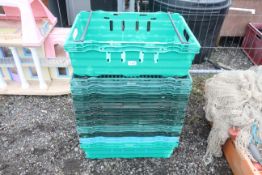 Twelve plastic stacking produce crates