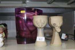 A heavy purple glass vase signed to base and two M