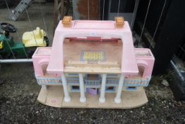 A child's Little Tykes dolls playhouse