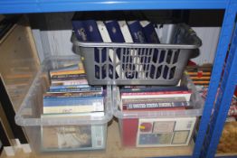 Three boxes containing reference works on paper mo