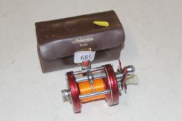 An Abu Ambassadeur 6000 fishing reel and leather c