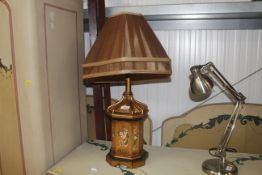 A decorative table lamp and shade