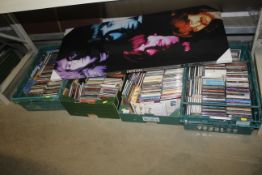 Four boxes containing various CDs together with a