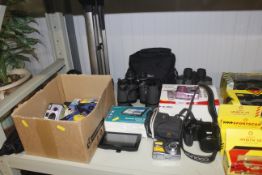 Two pairs of binoculars, Garmin sat nav together w