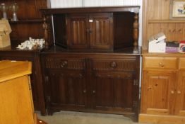 An Old Charm style oak court cupboard