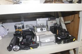 A collection of various cameras to include Polaroi