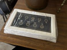 A white painted wooden framed servants bell.