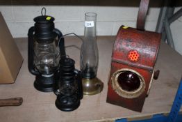 Three oil lamps and a Kenyons Serilight lamp dated for 1959