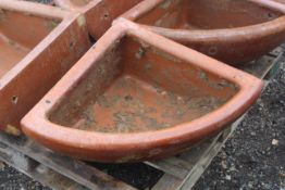 A quarter glazed stoneware horse feed bowl