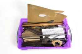 A box of glove makers tools including stretchers, scissors, stencil etc.