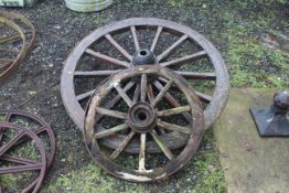 Two wooden framed cartwheels