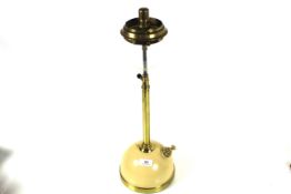A long stem Tilley table lamp with cream base