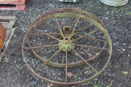 A pair of 9 spoke cast iron wheels
