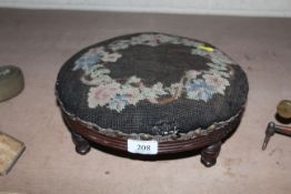 A small Victorian mahogany and needlework footstool
