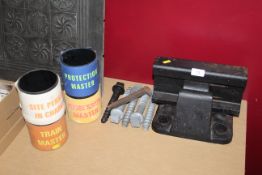 A saddle piece of London Underground track with four fixing bolts, four various railway armbands