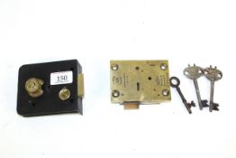 An early brass safe lock with key and a very early mortice lock with key