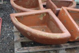 A quarter glazed stoneware horse feed bowl