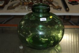 A green glass carboy, approx. 13