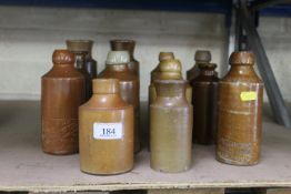 A quantity of small stoneware bottles including ginger beer bottles by W Bayliss of London, and an