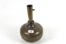 An Eastern brass vase