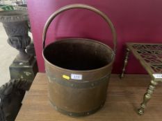 Copper and brass bound bucket with swing handle.
