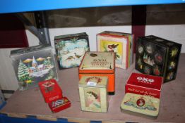 A quantity of decorative collectable biscuit tins