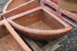 A quarter glazed stoneware horse feed bowl