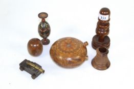 A small collection of antique treen including a gourd bottle, a double egg cup and a miniature